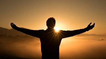 Man standing in warm morning sunlight