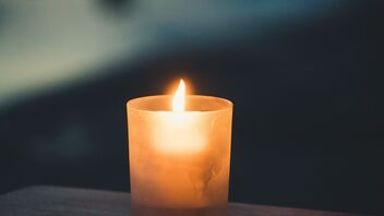 A single warm candle in the evening