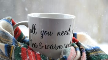 warm tea and cozy socks on a snowy winter day