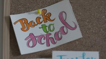 Back to school bulletin board with paper decorations