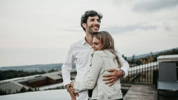 a couple embracing each other in comfort and support