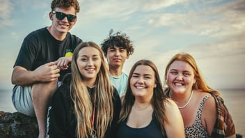 Diverse group of friends together at the beach