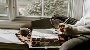 Person working through thoughts on paper
