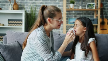 Mother and daughter in a caring moment at home
