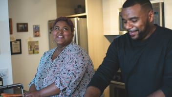 Couple working together at the kitchen sink