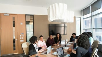 Colleagues in an attentive, respectful discussion