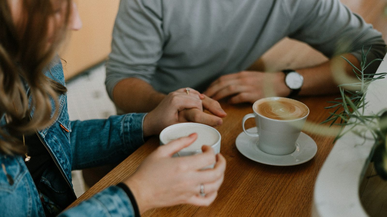 Two coffee mugs shared across a table