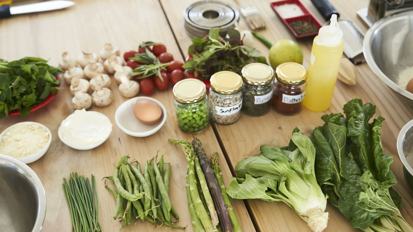 Fresh green vegetables on a wooden table