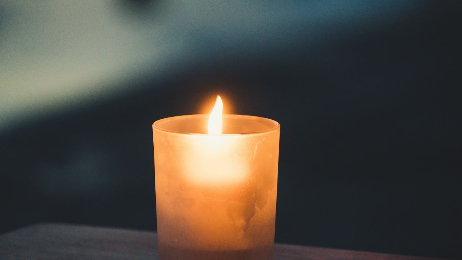 A single warm candle in the evening