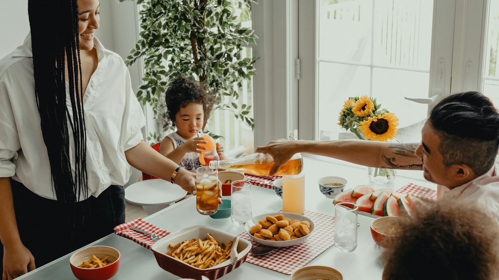 Mother and daughter together in the kitchen in the morning