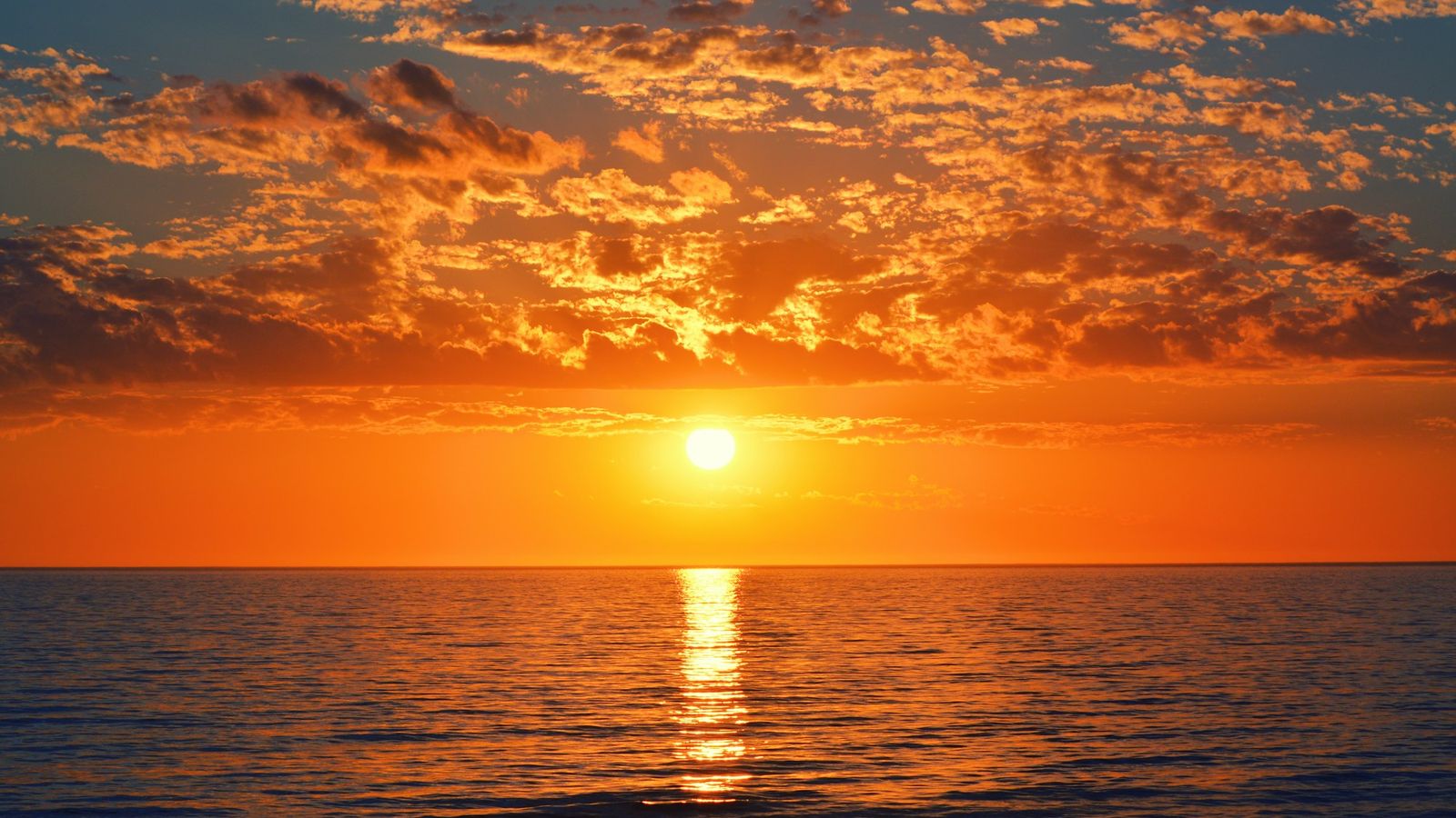 Low sun over a calm ocean