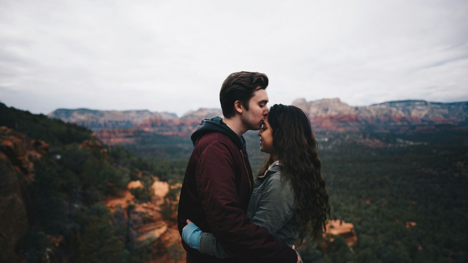 Warm forehead kiss between partners