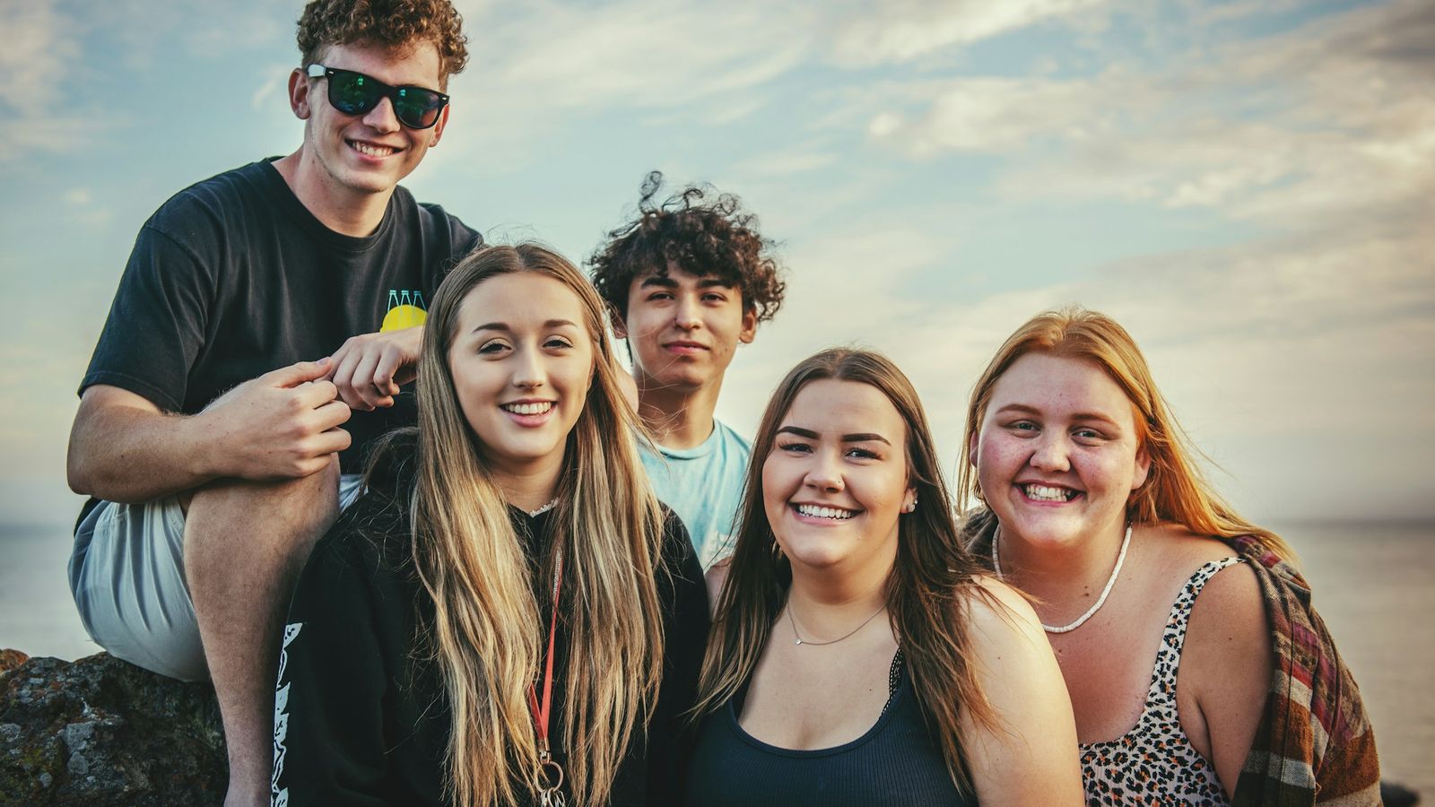 Diverse group of friends together at the beach