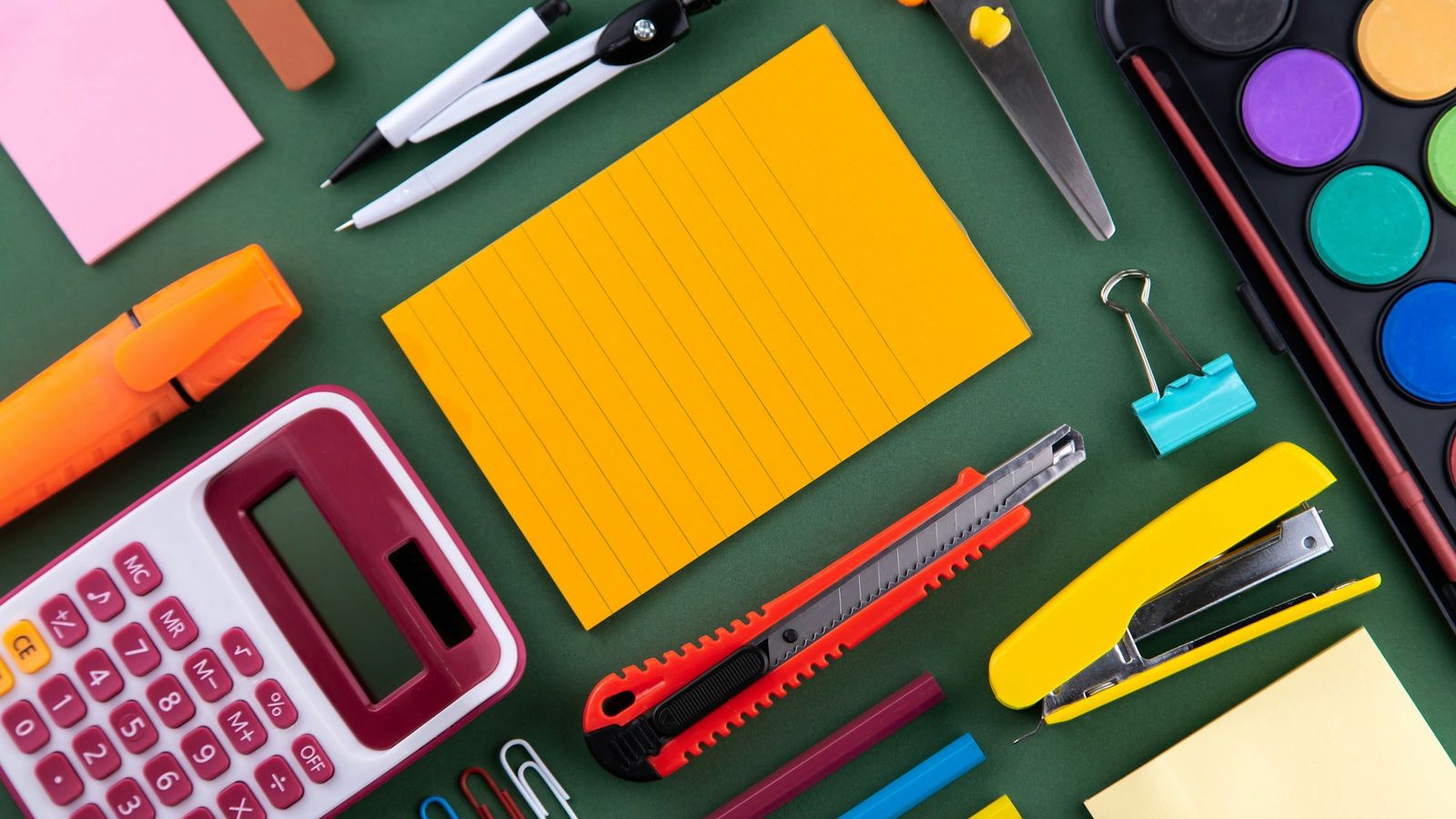 School supplies arranged on a bright surface