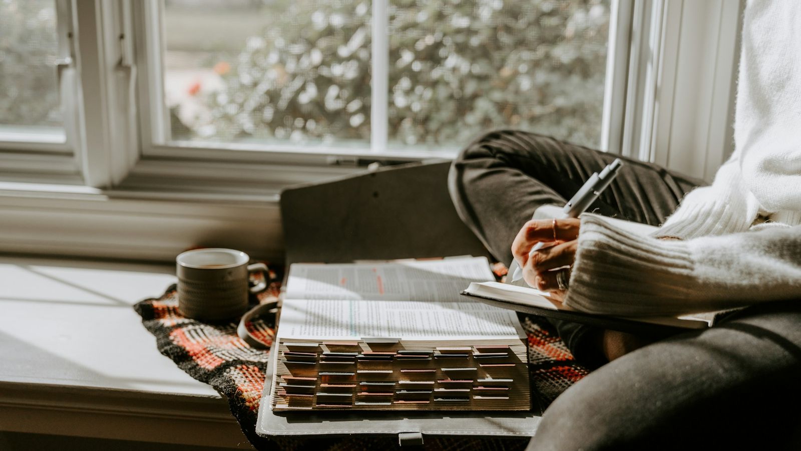 Person working through thoughts on paper
