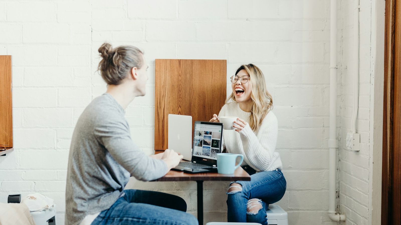 Two people in easy conversation at a table