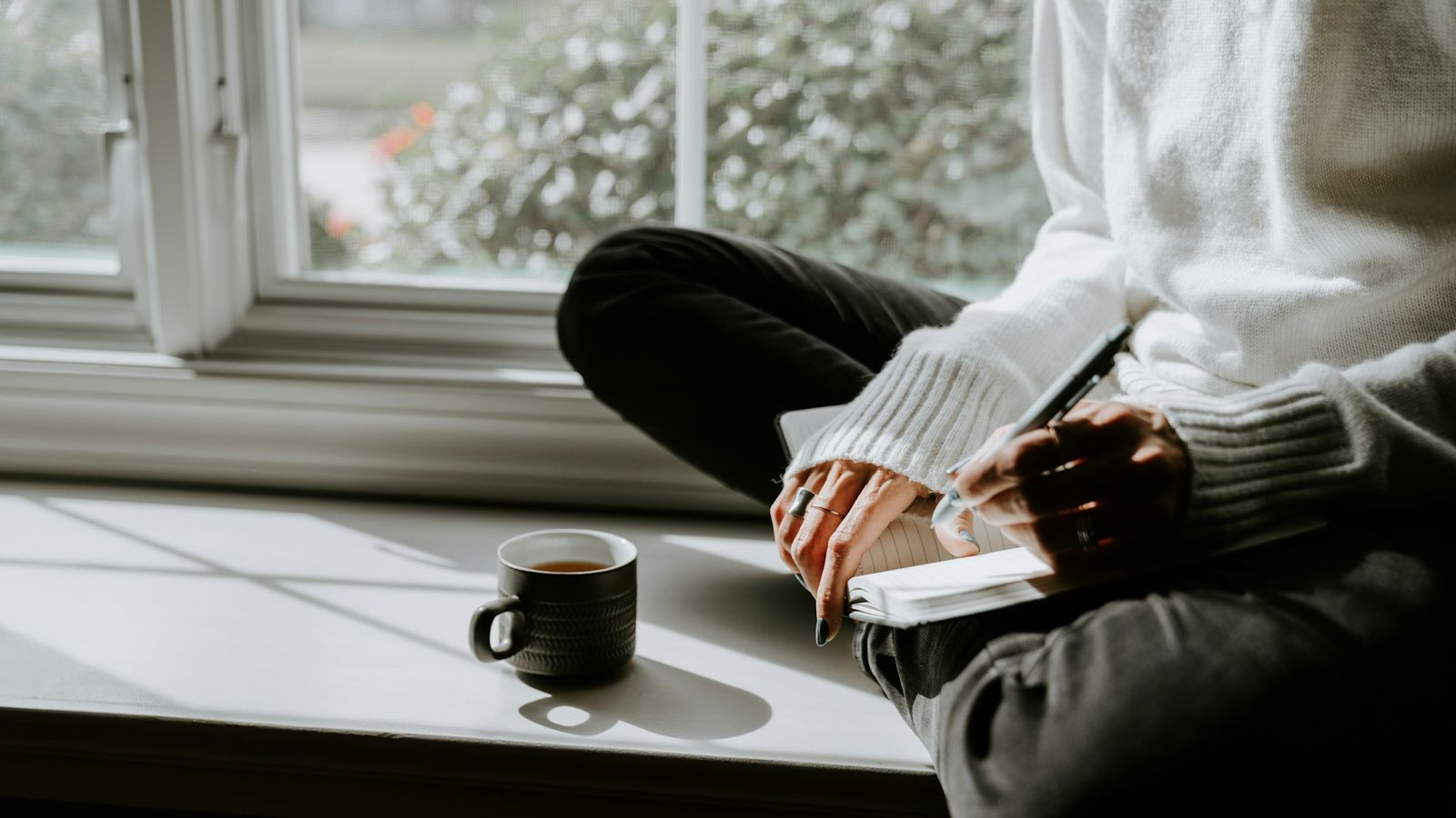Morning planning with coffee at the window