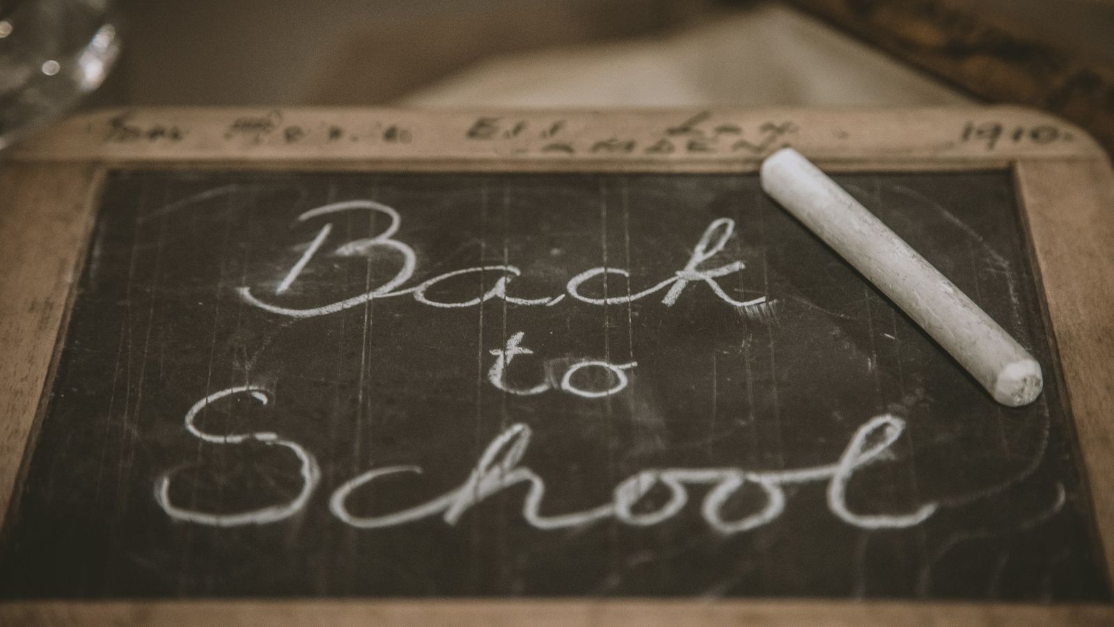 Back to school written in chalk on a blackboard