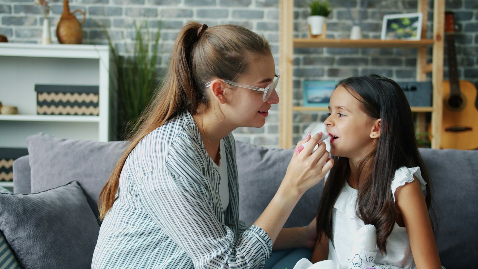 Mother and daughter in a caring moment at home