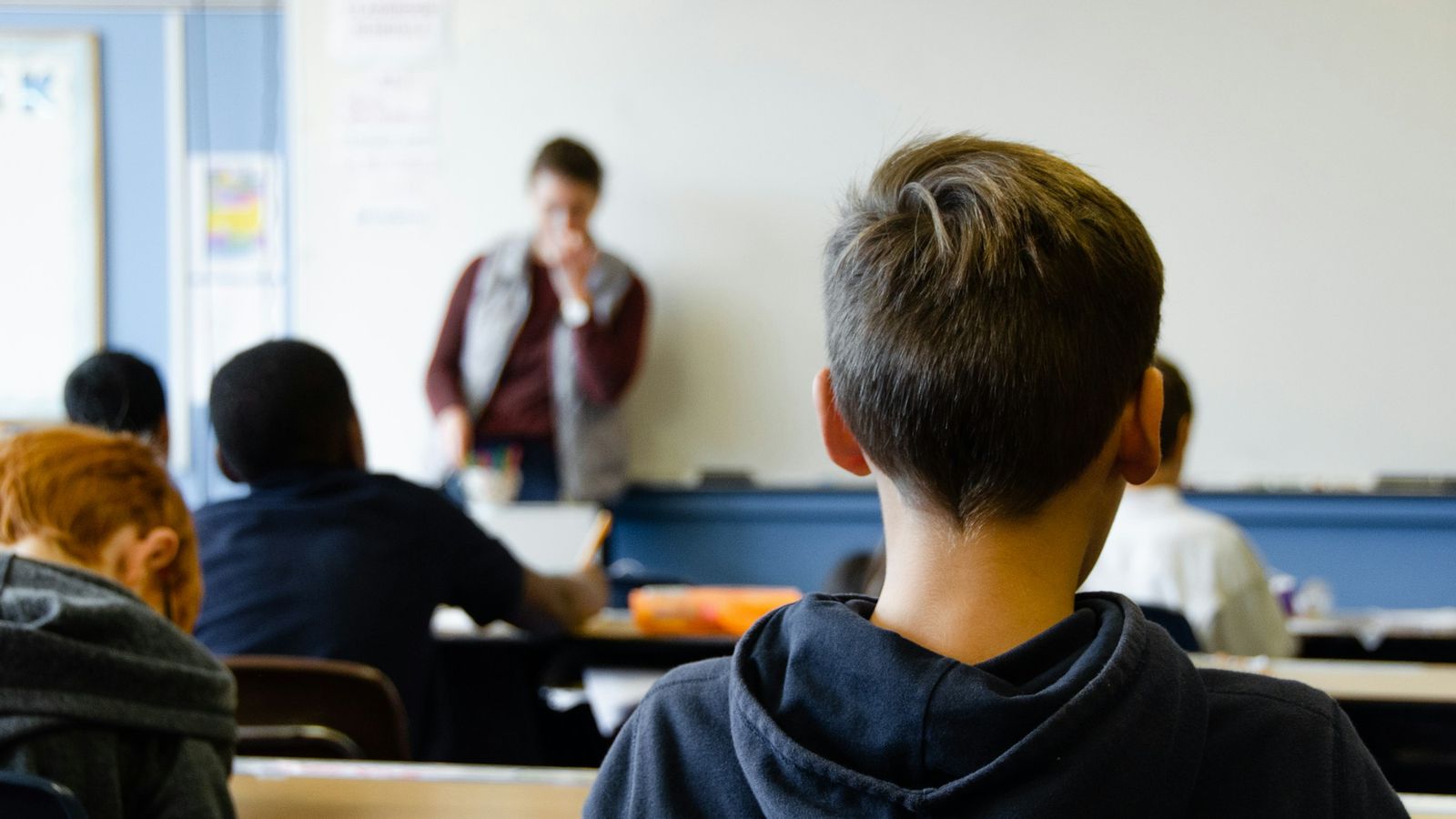 Students working at their desks in class