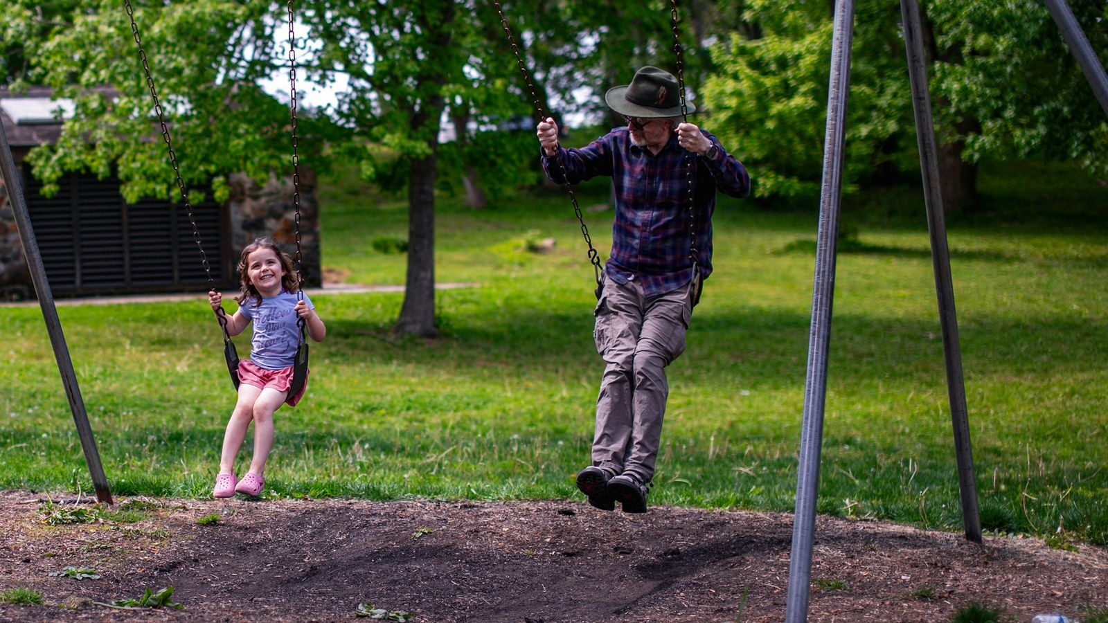 Parent and child playing together at the park