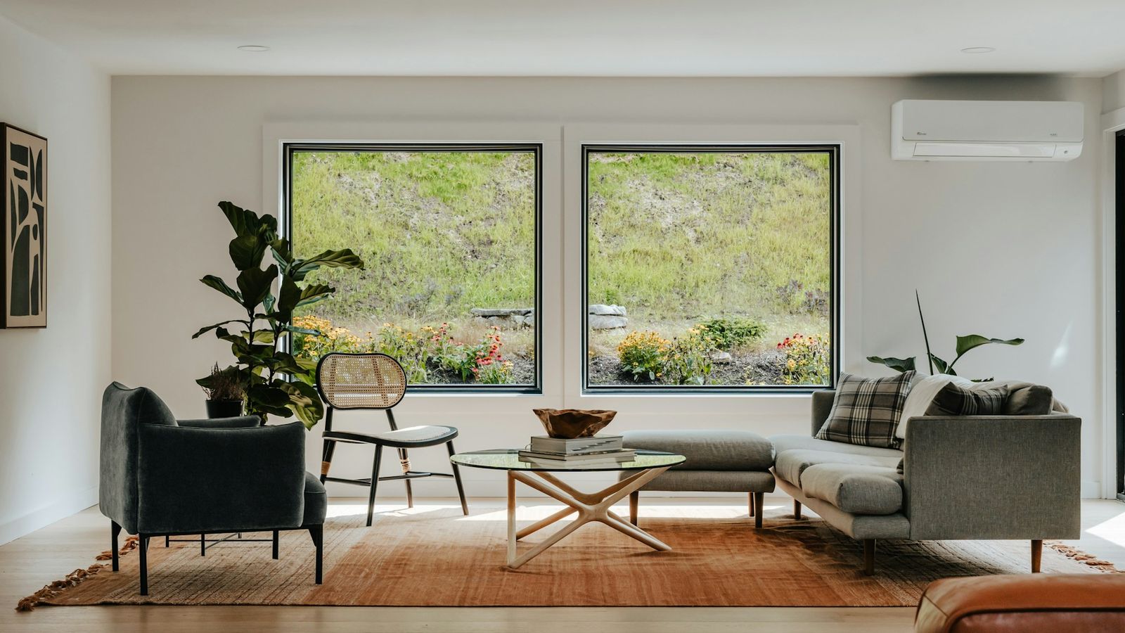 Bright, modern counseling office sitting room with large windows and comfortable chairs
