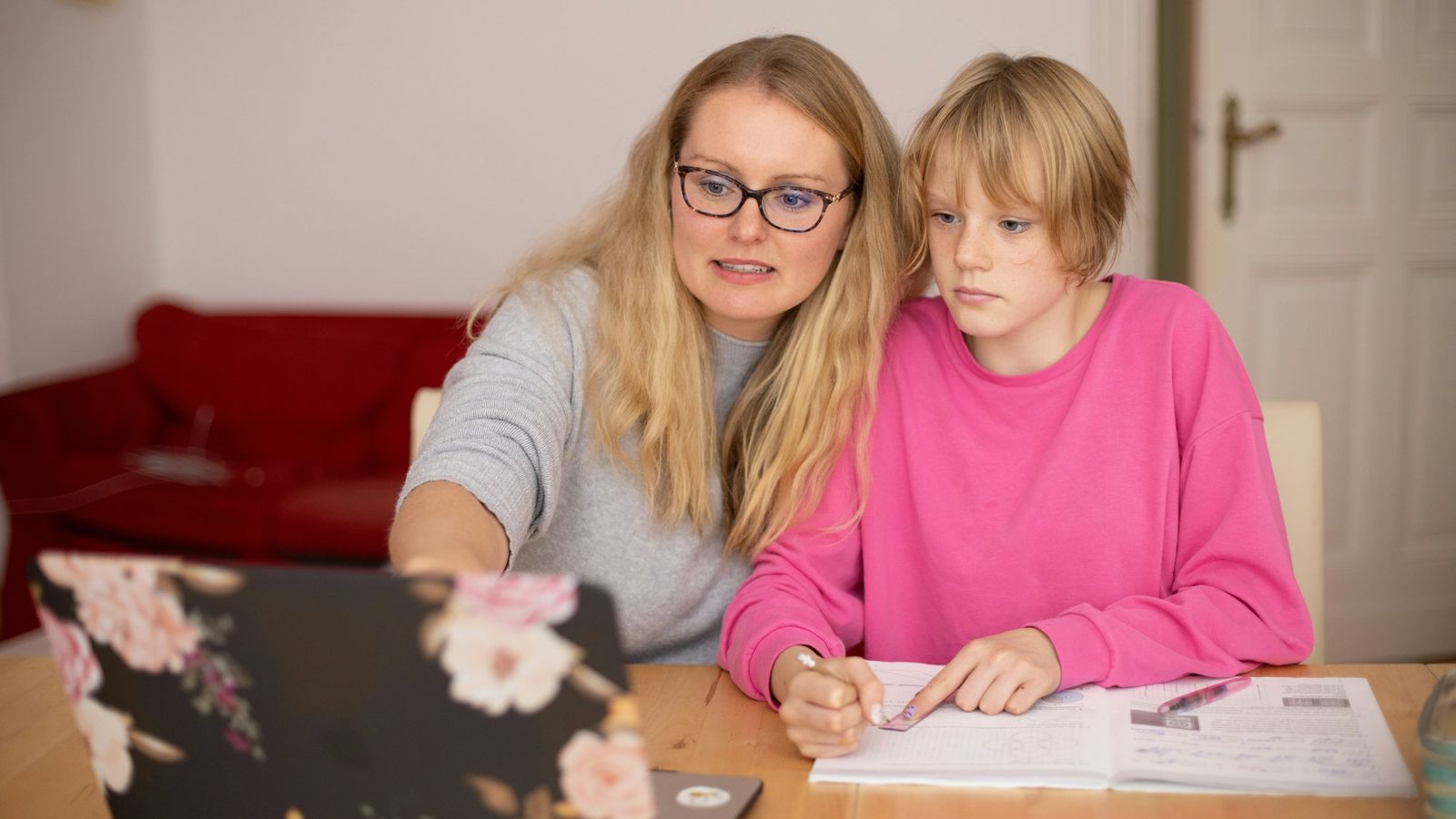 Mother and daughter learning together at a laptop