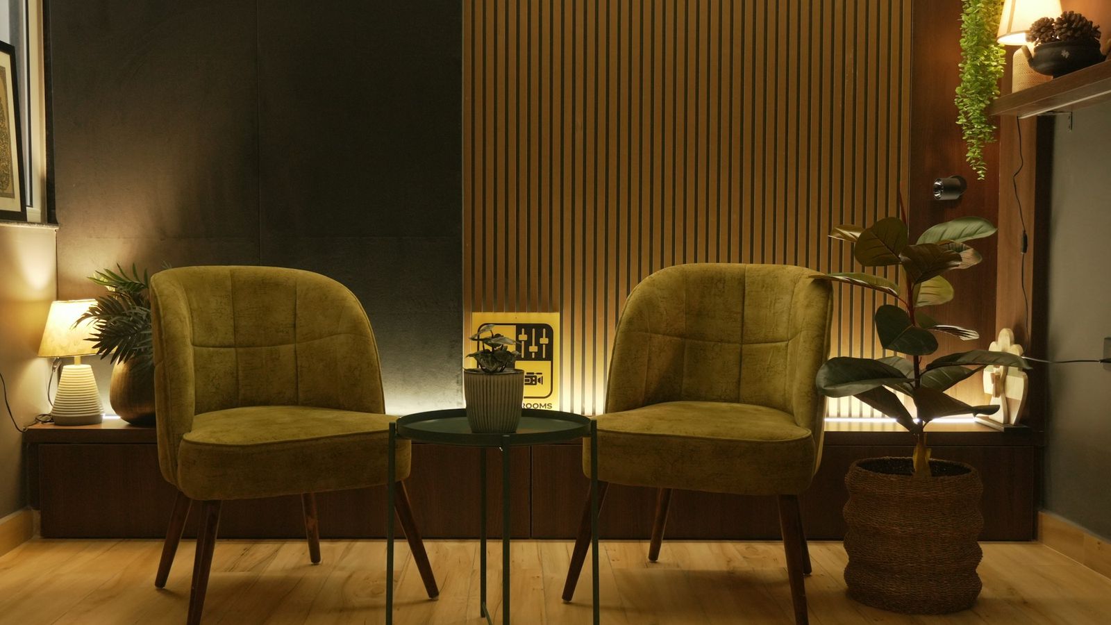 Cozy lounge with two green armchairs