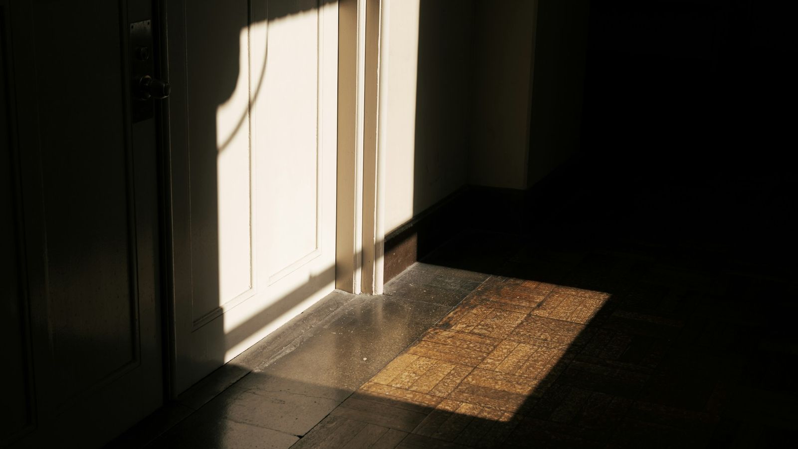 A door opening onto warm light